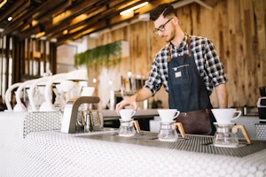 Barista making drip coffee