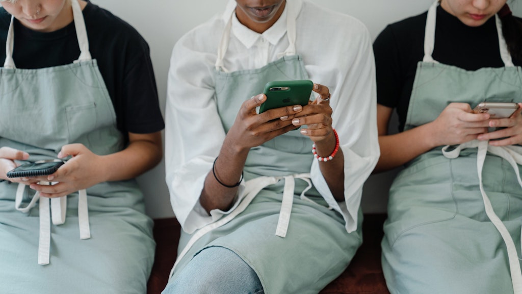 3 ladies on their phones