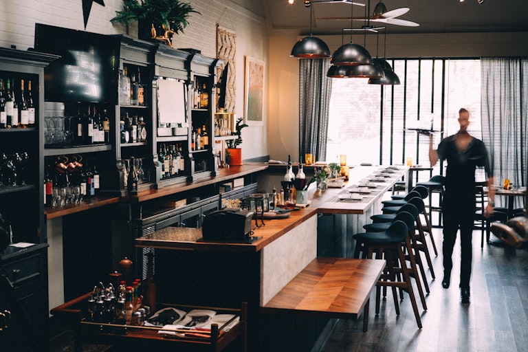 view of the bar and waiter